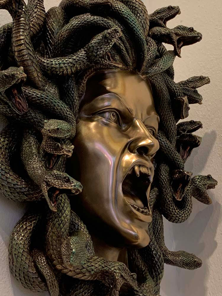 Beautifully sculptured Greek monster Medusa head sculpture with snakes