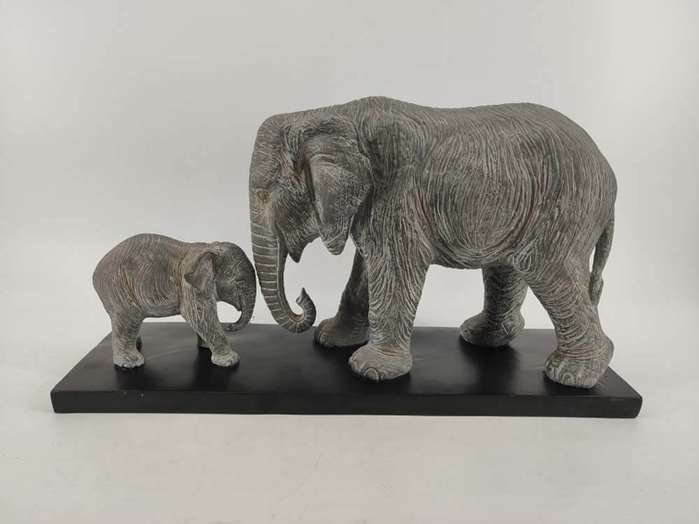 Grey elephant bull and calf statue
