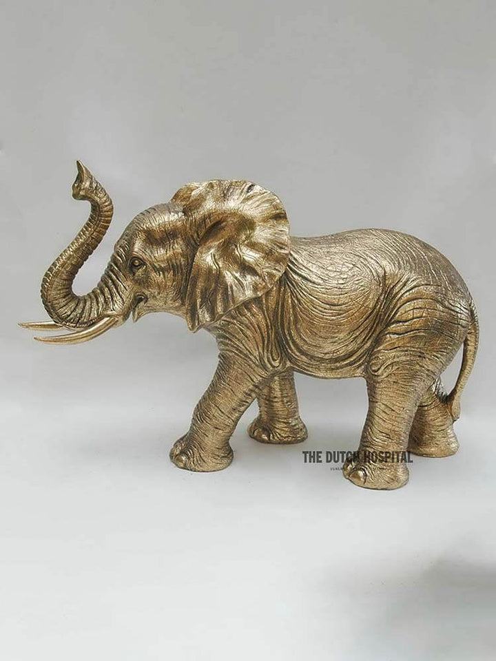 Large gold elephant decoration, elephant holding trunk up 