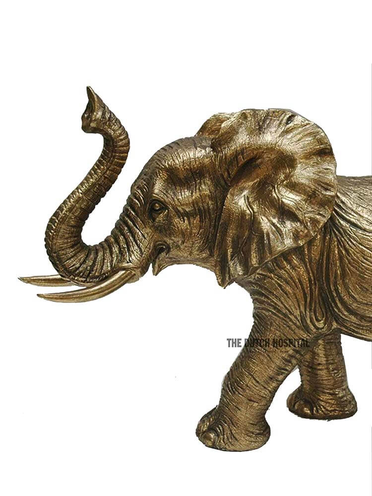 Large gold elephant decoration, elephant holding trunk up 