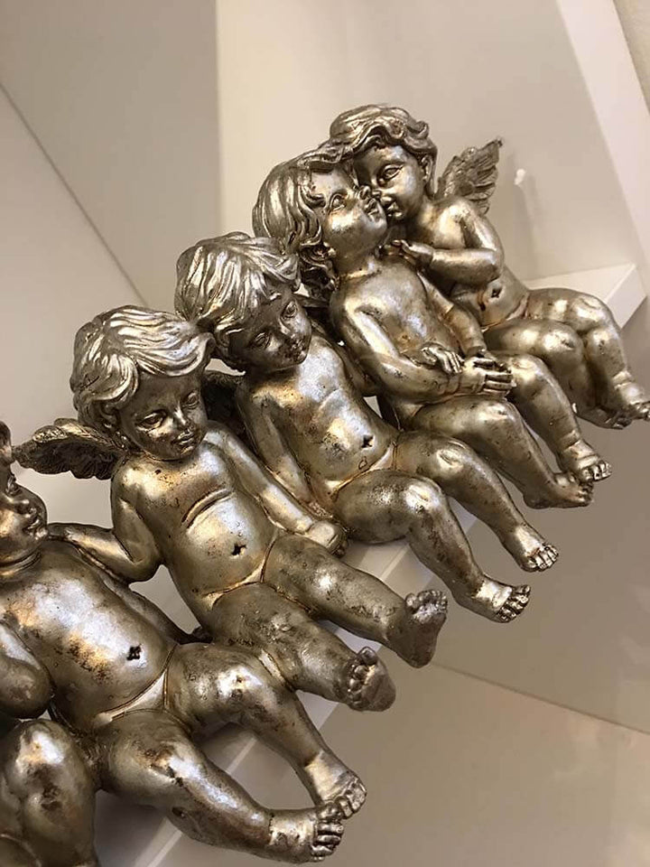 Sitting Row of Cherubs on shelves, Antique Silver Cherubs and Angels